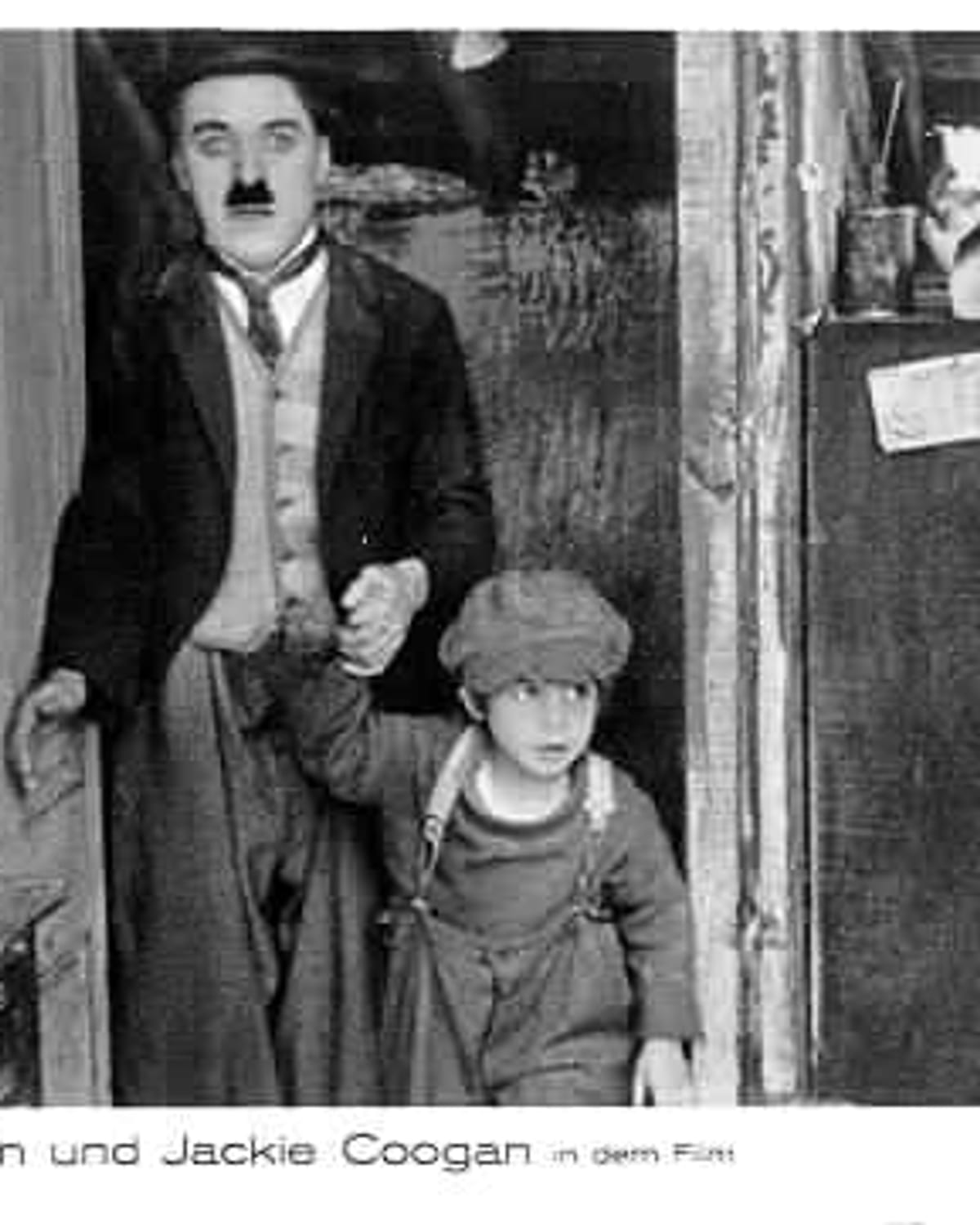 Charlie Chaplin and Jackie Coogan in The Kid