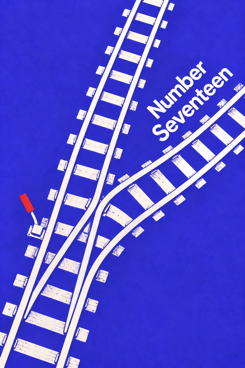 White railway tracks fork across vivid blue beside a red signal lever and diagonal title lettering.
